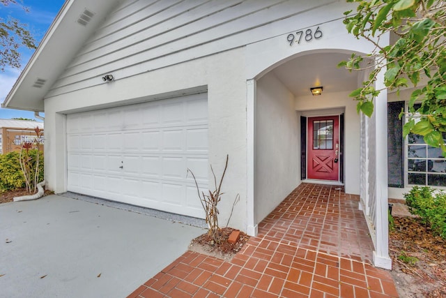 doorway to property featuring a garage