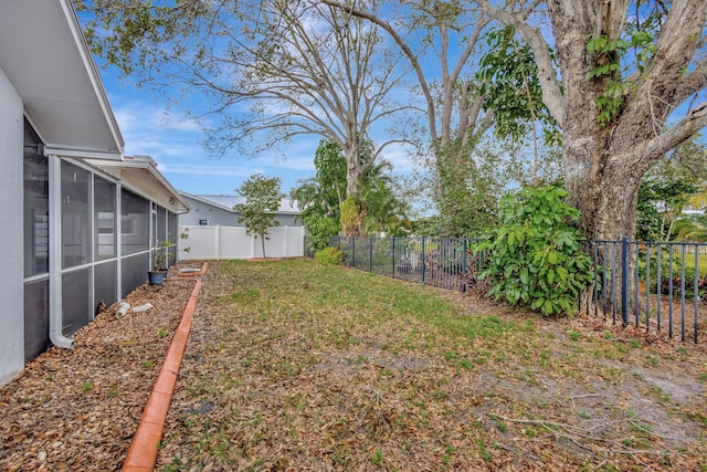 view of yard with a sunroom