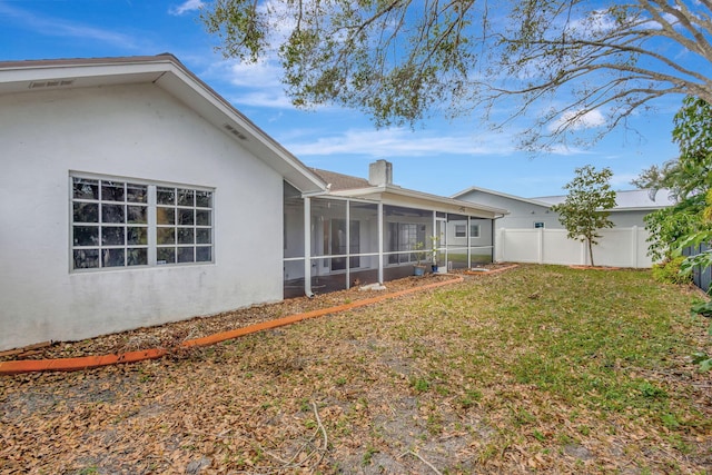 view of yard with a sunroom