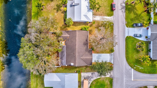 birds eye view of property featuring a water view