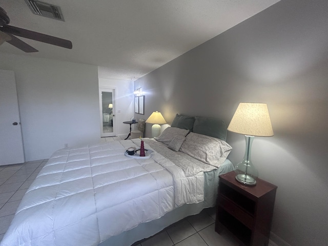 bedroom with tile patterned flooring and ceiling fan