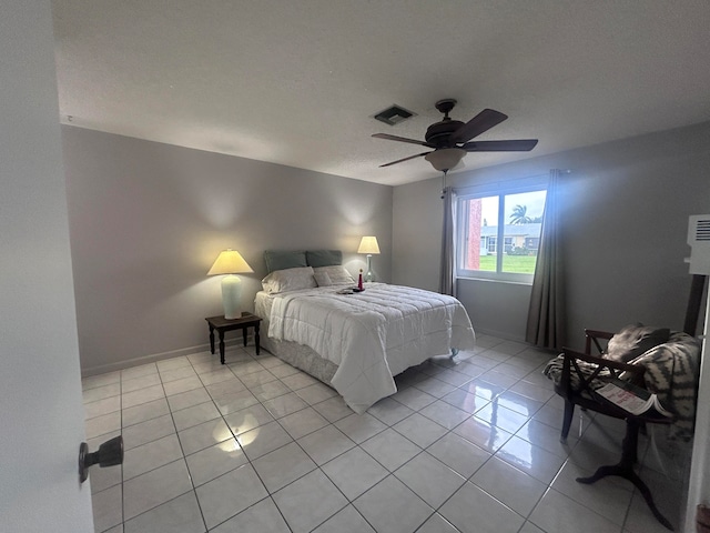 bedroom featuring ceiling fan and light tile patterned flooring