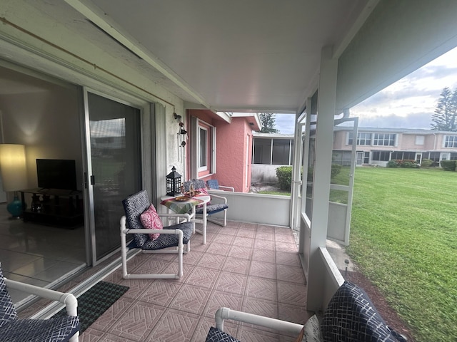 exterior space featuring tile patterned floors and ceiling fan