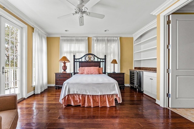 bedroom with ornamental molding, access to exterior, dark hardwood / wood-style flooring, and ceiling fan