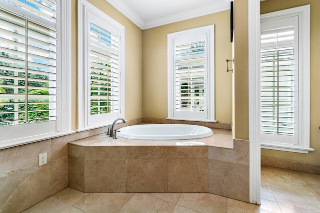 bathroom featuring tiled bath, tile patterned flooring, and crown molding