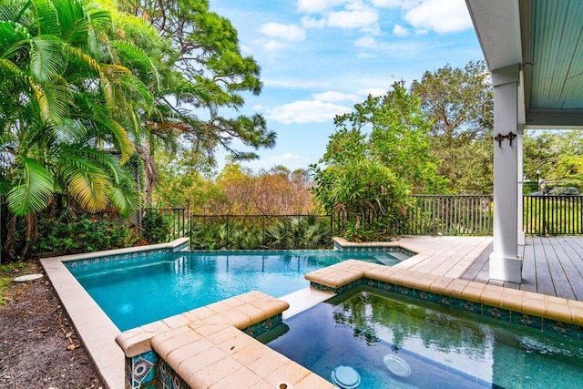 view of pool featuring an in ground hot tub and a patio area