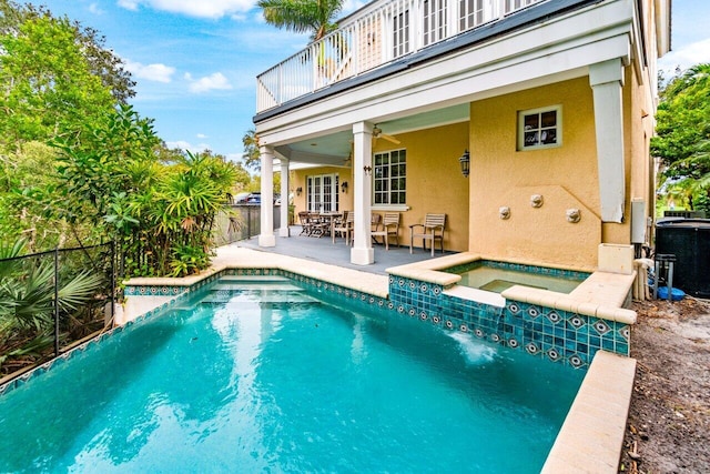 view of swimming pool featuring central air condition unit, a patio, and an in ground hot tub