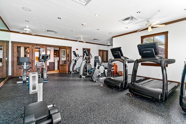 workout area featuring crown molding