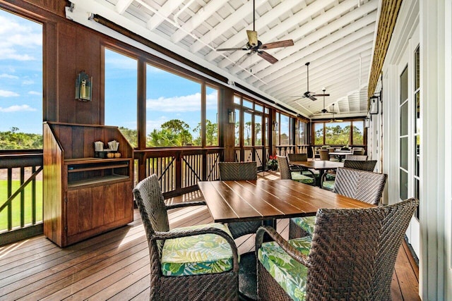 sunroom with a wealth of natural light, ceiling fan, and lofted ceiling