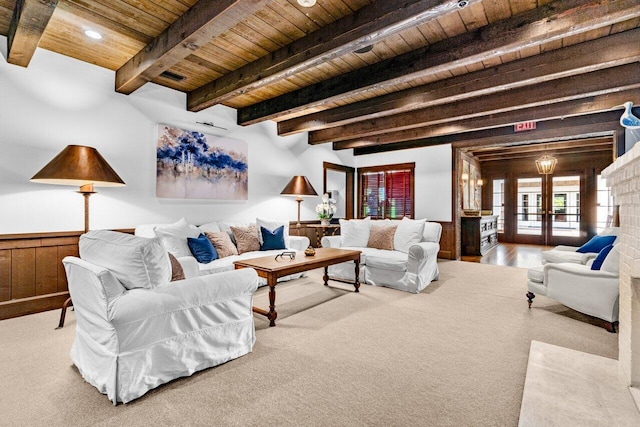 living room featuring wood walls, french doors, wood ceiling, and beam ceiling