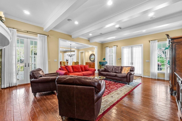 living room with dark hardwood / wood-style flooring, beam ceiling, french doors, and ornamental molding