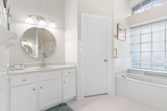 full bath with a bath, tile patterned flooring, and vanity
