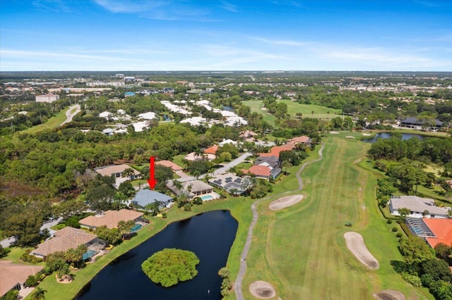 aerial view featuring a residential view, golf course view, and a water view