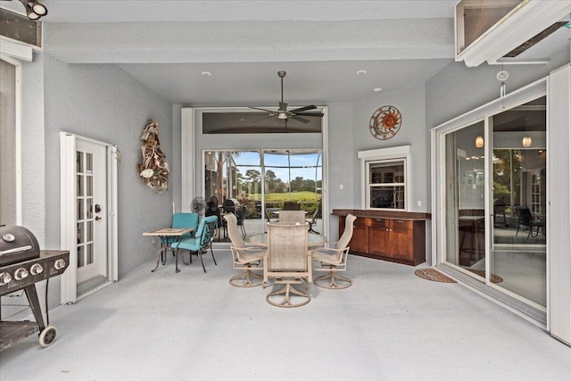 view of patio with a ceiling fan and outdoor dining space