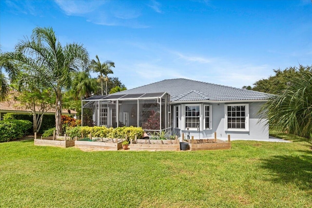 rear view of property with a yard