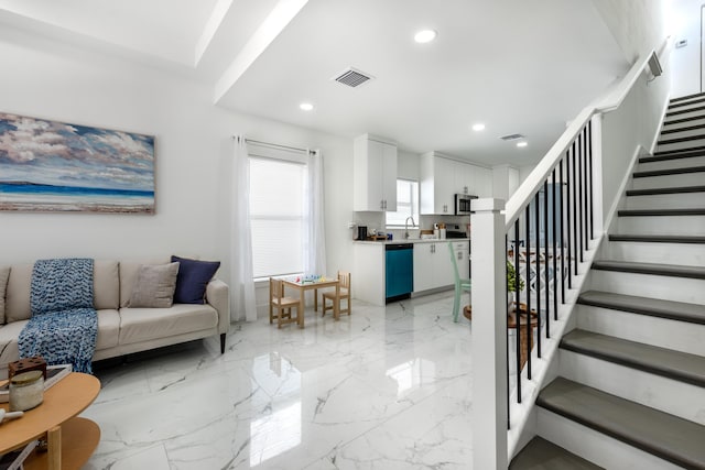 living room featuring recessed lighting, stairway, marble finish floor, and visible vents