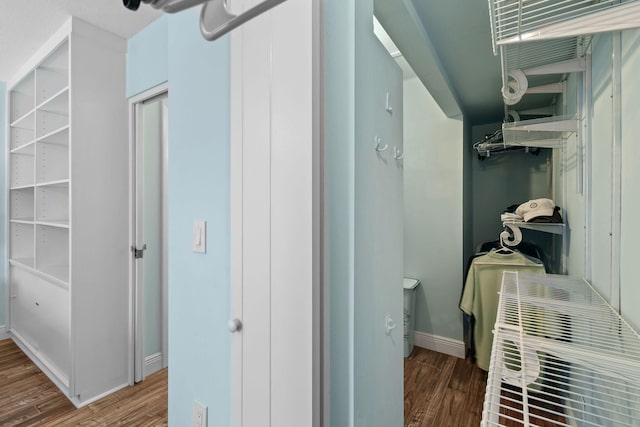 hallway with dark wood-type flooring