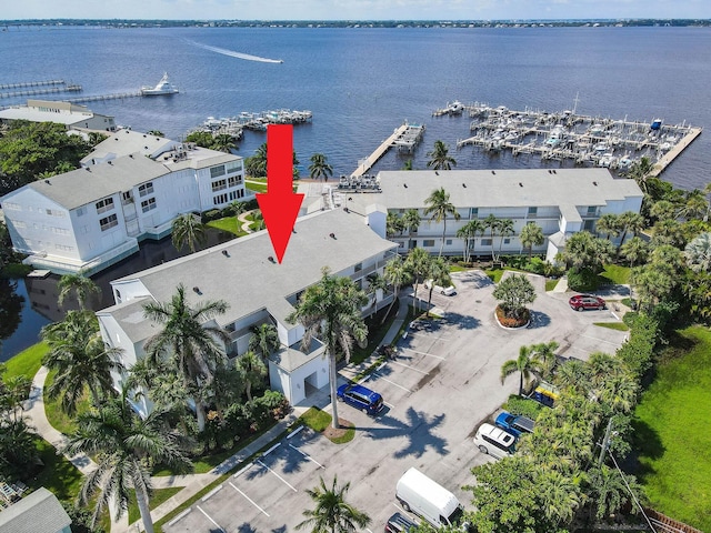 birds eye view of property with a water view