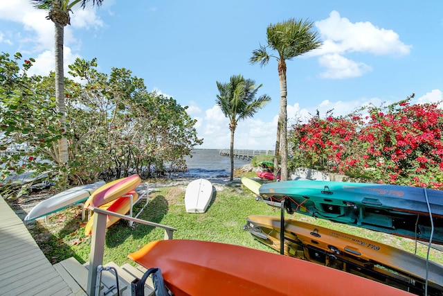 wooden terrace featuring a water view