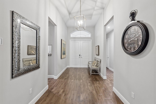 corridor with a notable chandelier