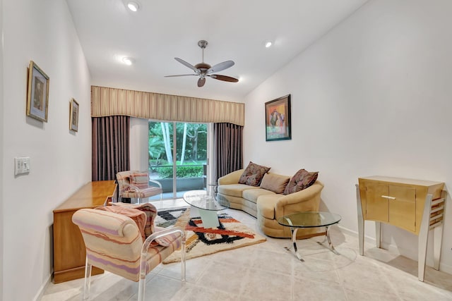 tiled living room featuring ceiling fan and lofted ceiling