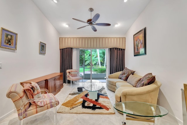 living room featuring lofted ceiling, light tile patterned floors, and ceiling fan