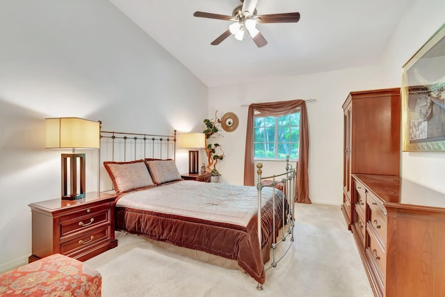 carpeted bedroom featuring ceiling fan and lofted ceiling