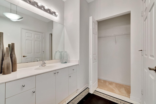 bathroom with vanity and tile patterned flooring