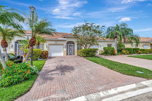 mediterranean / spanish-style home featuring a garage