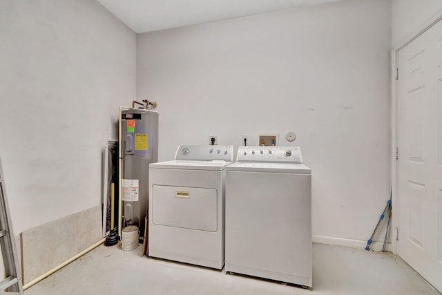 clothes washing area featuring water heater and separate washer and dryer