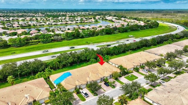 birds eye view of property with a water view