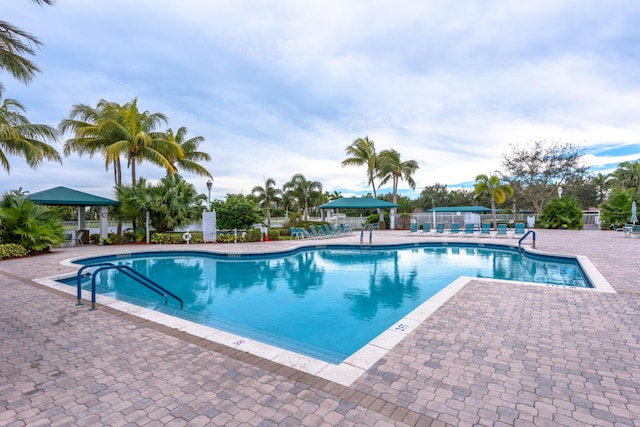 view of swimming pool featuring a patio area