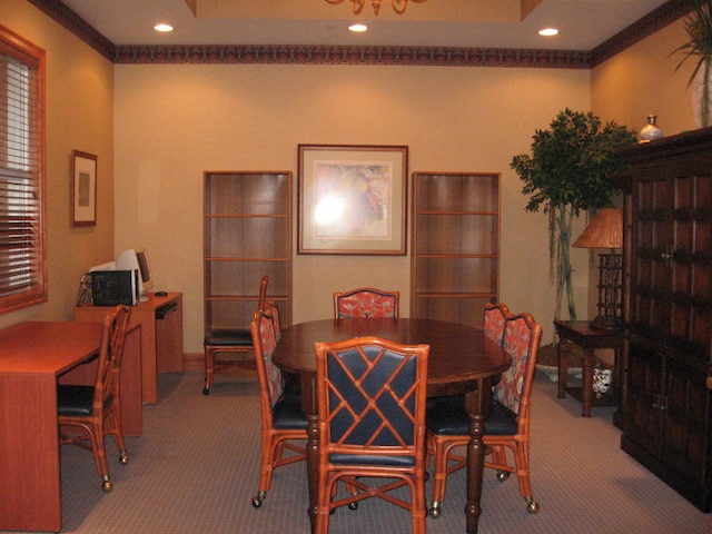 dining space featuring crown molding and carpet floors