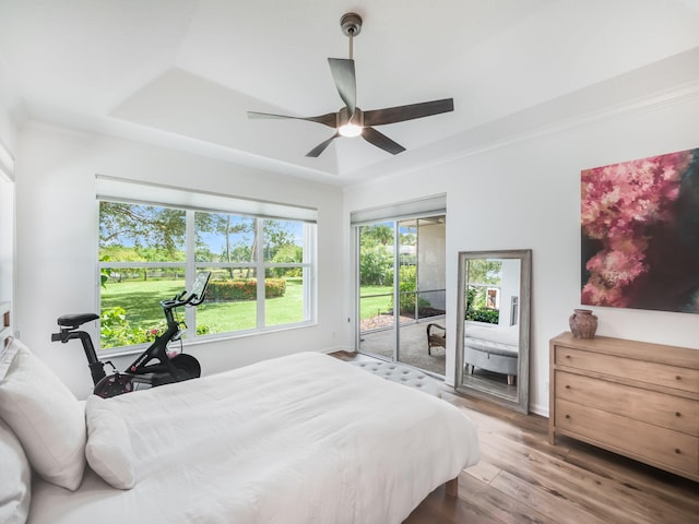 bedroom with ceiling fan, hardwood / wood-style flooring, access to outside, and crown molding