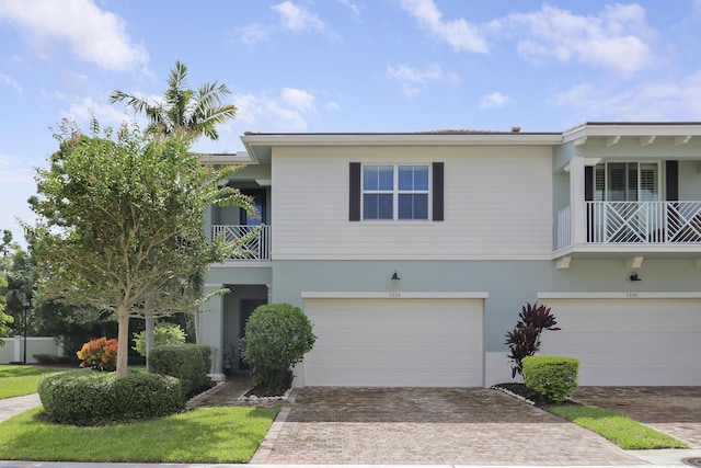 view of front of house with a balcony and a garage