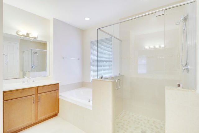 bathroom featuring tile patterned floors, vanity, and independent shower and bath