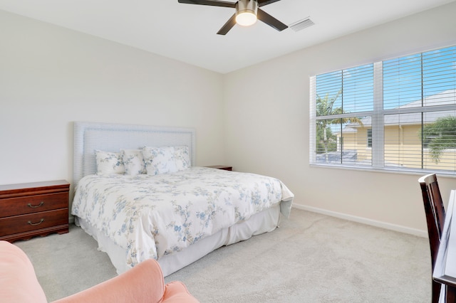 bedroom featuring light carpet and ceiling fan