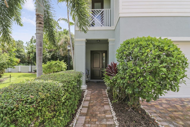 entrance to property with a balcony