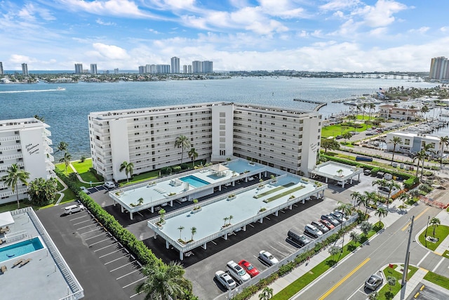 birds eye view of property with a water view