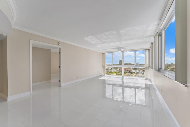 tiled spare room with ornamental molding