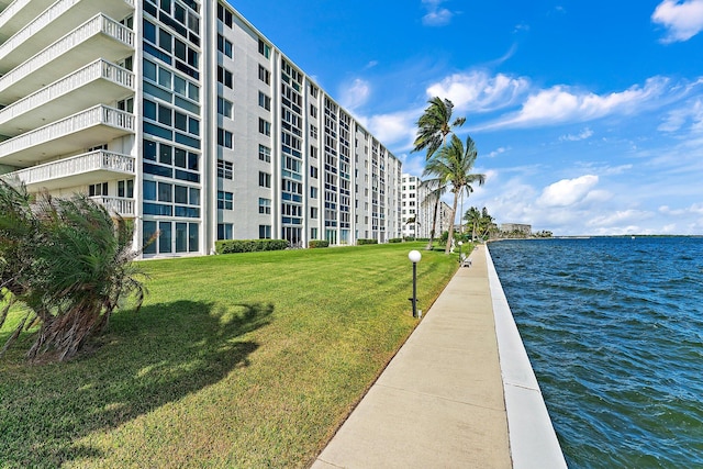 view of building exterior with a water view