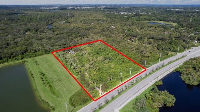 birds eye view of property featuring a water view