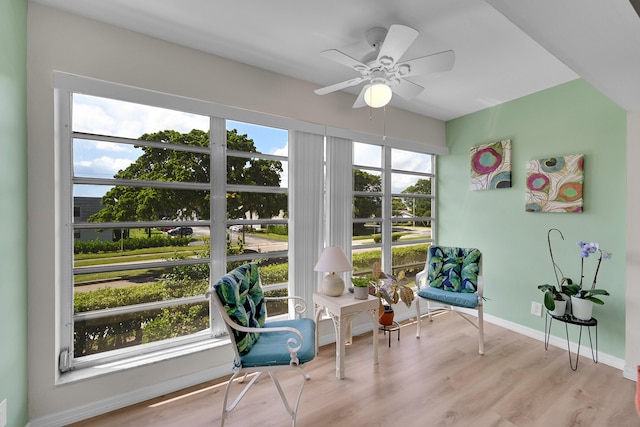 sunroom featuring ceiling fan