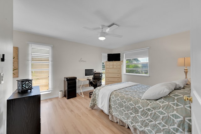 bedroom with ceiling fan and hardwood / wood-style flooring