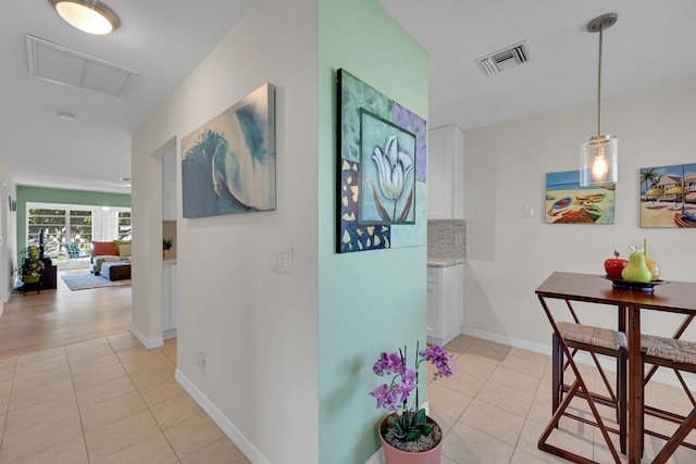 hallway featuring light tile patterned flooring