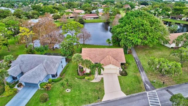 drone / aerial view with a water view