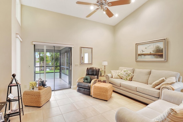 living room featuring light tile patterned floors, high vaulted ceiling, and ceiling fan