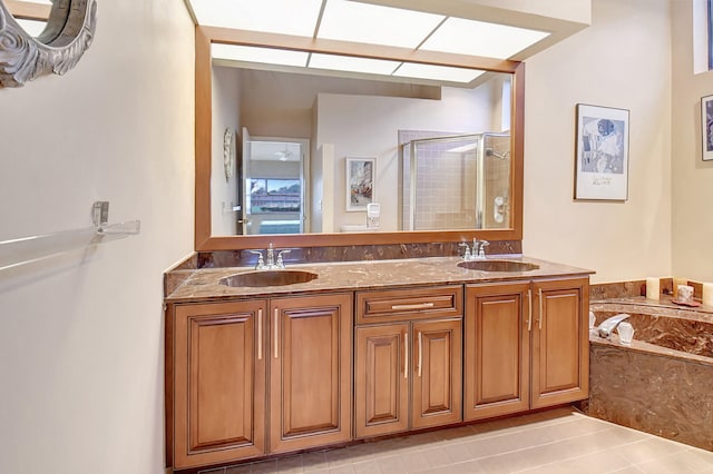 bathroom with vanity, independent shower and bath, and tile patterned flooring