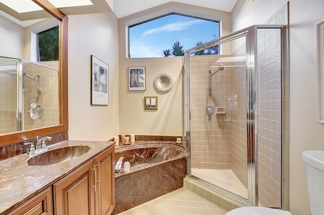 full bathroom featuring toilet, tile patterned flooring, separate shower and tub, vaulted ceiling, and vanity