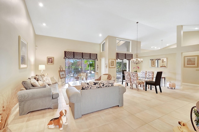 tiled living room featuring a notable chandelier and high vaulted ceiling